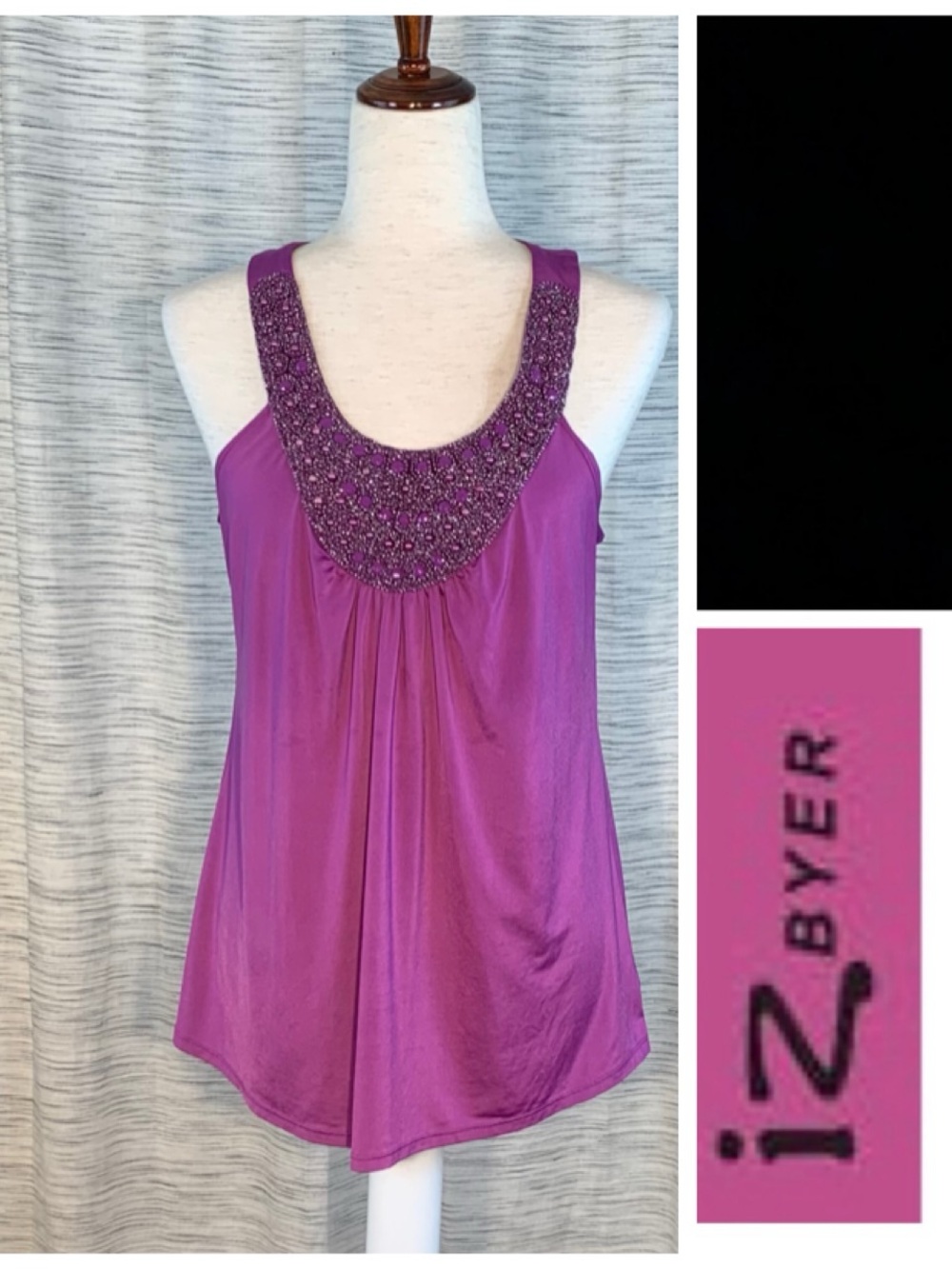 iz Byer purple sleeveless pullover top.